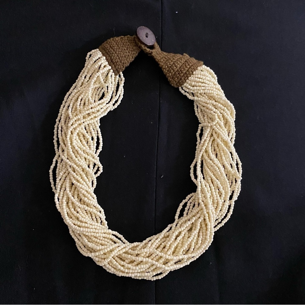 Multi Strand Twisted Ivory Bead Necklace w/ crochet and coconut shell lock